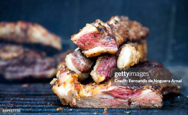 asado argentino - brasa stock pictures, royalty-free photos & images