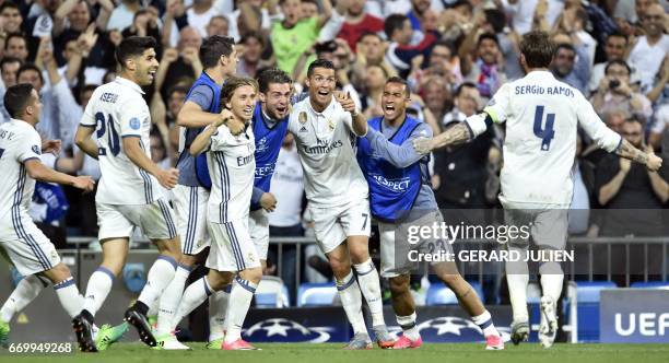 Real Madrid's Portuguese forward Cristiano Ronaldo celebrates after scoring during the UEFA Champions League quarter-final second leg football match...