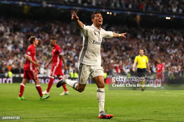 Cristiano Ronaldo of Real Madrid CF celebrates scoring his side's third goal during the UEFA Champions League Quarter Final second leg match between...