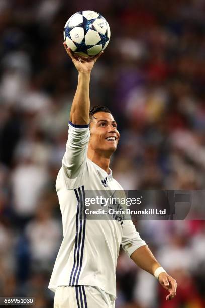 Cristiano Ronaldo of Real Madrid CF celebrates with the match ball following the UEFA Champions League Quarter Final second leg match between Real...