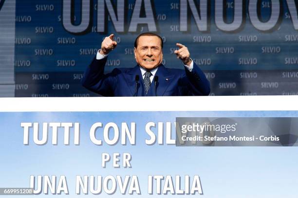 Silvio Berlusconi gives a speech on stage during the national protest 'Tutti con Silvio' at Piazza del Popolo on March 23, 2013 in Rome, Italy....