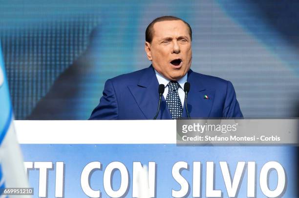 Silvio Berlusconi gives a speech on stage during the national protest 'Tutti con Silvio' at Piazza del Popolo on March 23, 2013 in Rome, Italy....