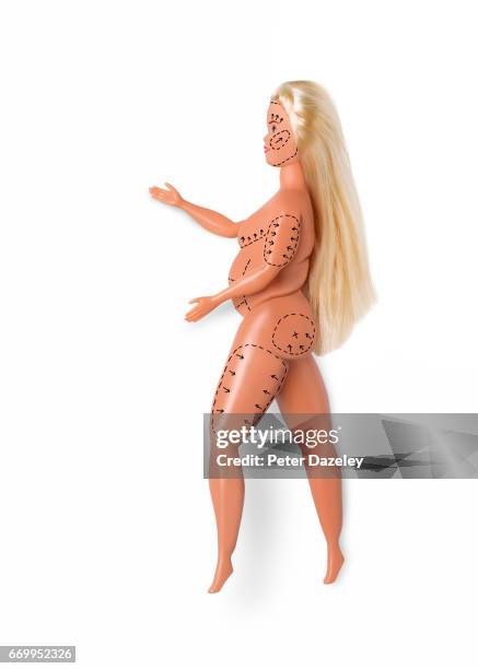 doll marked up for plastic surgery - plastic surgery stockfoto's en -beelden
