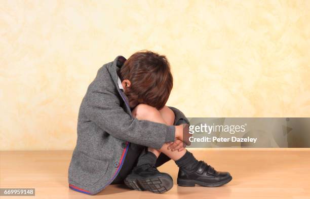 school boy sitting alone a poor child is bullied at school - boarding school bildbanksfoton och bilder