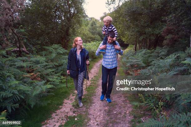 young family out walking - christopher guy stock pictures, royalty-free photos & images