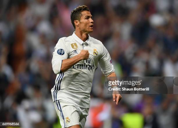 Cristiano Ronaldo of Real Madrid celebrates scoring his sides first goal and his hatrick during the UEFA Champions League Quarter Final second leg...