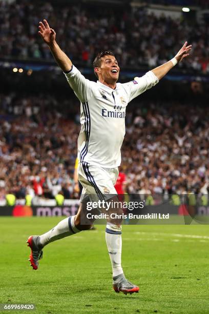 Cristiano Ronaldo of Real Madrid CF celebrates scoring his side's third goal during the UEFA Champions League Quarter Final second leg match between...