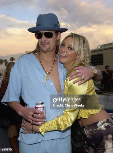 Kid Rock and Britney Spears look-alike arrive at the 28th Annual American Music Awards January 8, 2001 at the Shrine Auditorium in Los Angeles, CA.