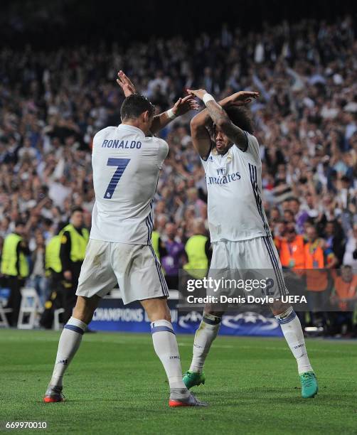 Cristiano Ronaldo of Real Madrid CF celebrates with Marcelo after scoring his 3rd goal during the UEFA Champions League Quarter Final second leg...