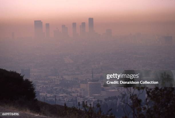 View of the cityscape and downtown skyline with the Capitol Records building in the foreground from Mulholland Drive in May 1984 in Los Angeles,...