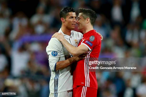 Cristiano Ronaldo of Real Madrid CF clashes hands with Robert Lewandowski of Bayern Muenchen after the UEFA Champions League Quarter Final second leg...