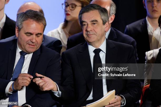 Xavier Bertrand and French presidential candidate Francois Fillon attend a campaign rally on April 18, 2017 in Lille, France.