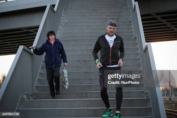 Group of people is seen taking part in a monthly organized track running event at the newly built Bydgoszcz Wschod train station on 18 April, 2017.