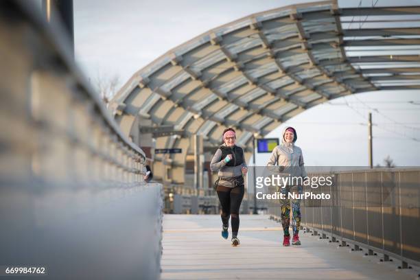 Group of people is seen taking part in a monthly organized track running event at the newly built Bydgoszcz Wschod train station on 18 April, 2017.