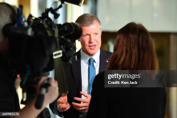 Scottish Liberal Democrat leader Willie Rennie gives a media interview in the Garden Lobby of the Scottish Parliament soon after the announcement of...