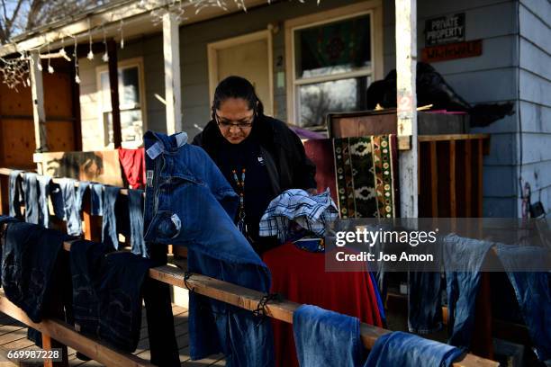 Vernissa Jorgenson 44, checking the laundry drying on the porch of her home in Ethete on the Wind River Indian Reservation. "I speak a few words,"...