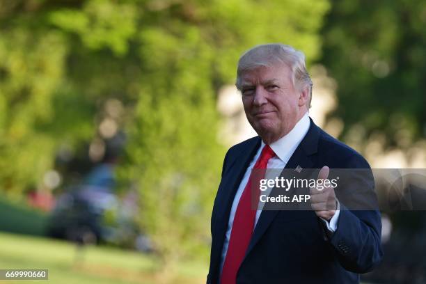 President Donald Trump makes his way across the South Lawn upon return to the White House in Washington, DC on April 18 after visiting Wisconsin.