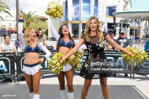 Charissa Thompson poses with the Los Angeles Chargers visits "Extra" at Universal Studios Hollywood on April 18, 2017 in Universal City, California.