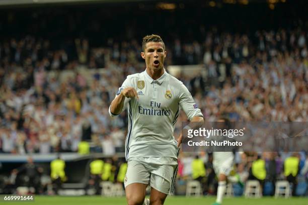 Cristiano Ronaldo of Real Madrid CF celebrates scoring his side's third goal during the UEFA Champions League Quarter Final second leg match between...