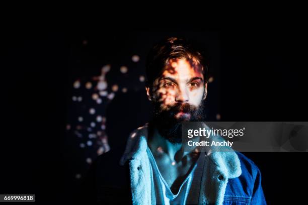 firecracker spark image projected on a young man upper body - face projection stock pictures, royalty-free photos & images