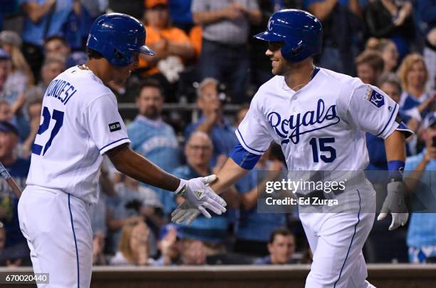 Whit Merrifield of the Kansas City Royals celebrates his home run with Raul Mondesi in the fifth inning against the San Francisco Giants at Kauffman...