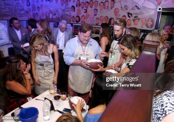 Lindsay Ell, Kevin Farley, Shawn Booth, and Kaitlyn Bristowe serve during the 16th Annual Waiting for Wishes Celebrity Dinner Hosted by Kevin Carter...