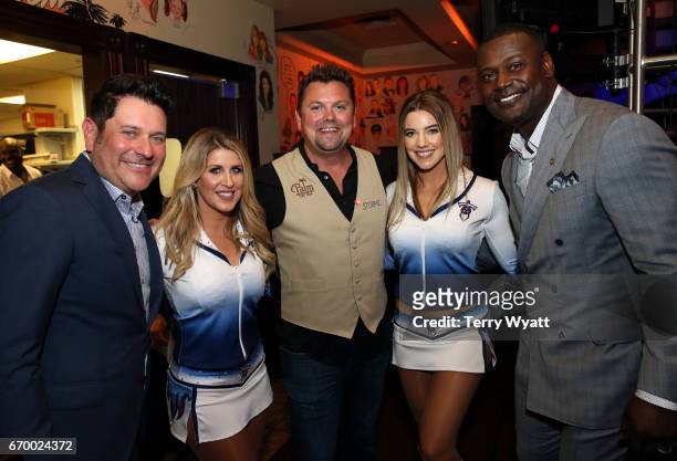 Jay DeMarcus, Storme Warren, and Kevin Carter pose with Tennessee Titans Cheerleaders during the 16th Annual Waiting for Wishes Celebrity Dinner...