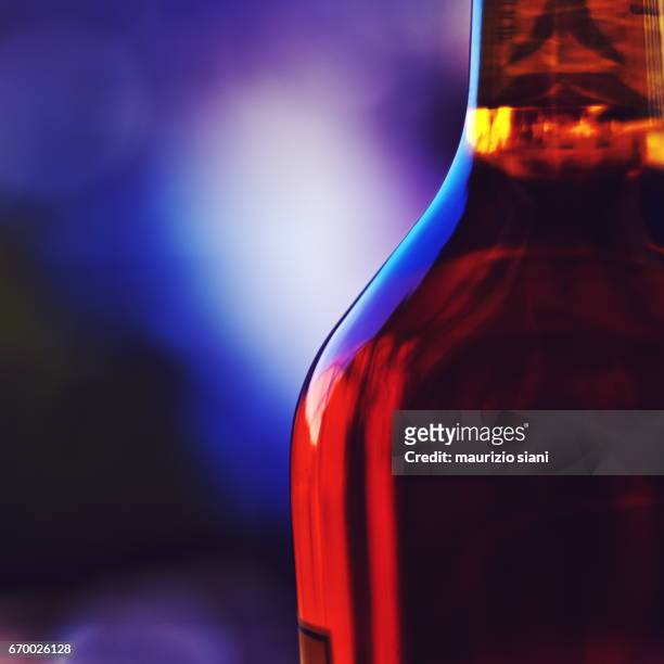 close-up of scotch bottle - arancione stock pictures, royalty-free photos & images