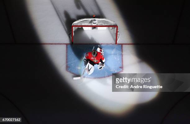 Craig Anderson of the Ottawa Senators stretches in his crease during player introductions prior to playing against the Boston Bruins in Game Two of...
