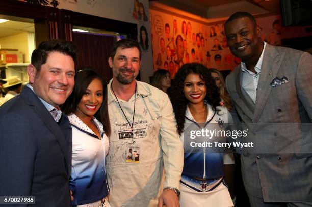 Jay DeMarcus, Shad Hamilton, and Kevin Carter pose with Tennessee Titans Cheerleaders during the 16th Annual Waiting for Wishes Celebrity Dinner...