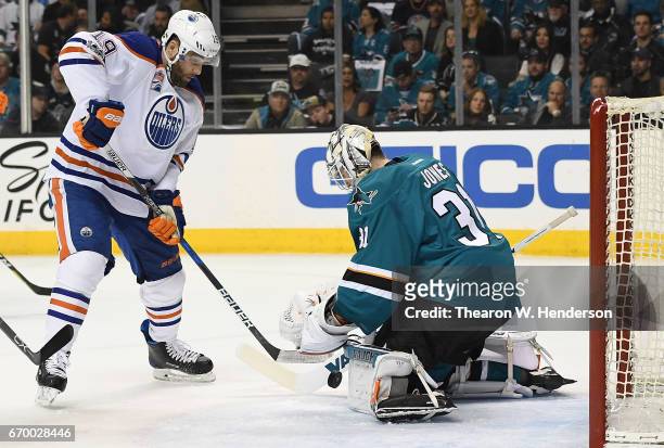 Goalie Martin Jones of the San Jose Sharks blocks the shot of Patrick Maroon of the Edmonton Oilers during the first period in Game Four of the...