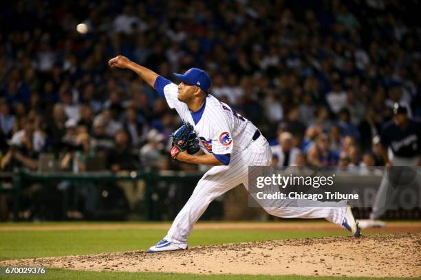 Chicago Cubs pitcher Hector Rondon works during the eighth inning against the Milwaukee Brewers at Wrigley Field in Chicago on Tuesday, April 18,...