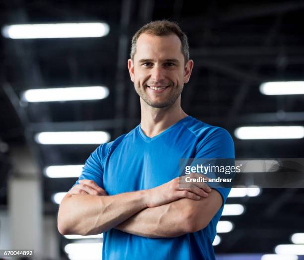 portrait of a personal trainer at the gym - gym coach stock pictures, royalty-free photos & images