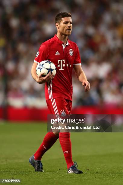 Xabi Alonso of FC Bayern Muenchen looks on during the UEFA Champions League Quarter Final second leg match between Real Madrid CF and FC Bayern...