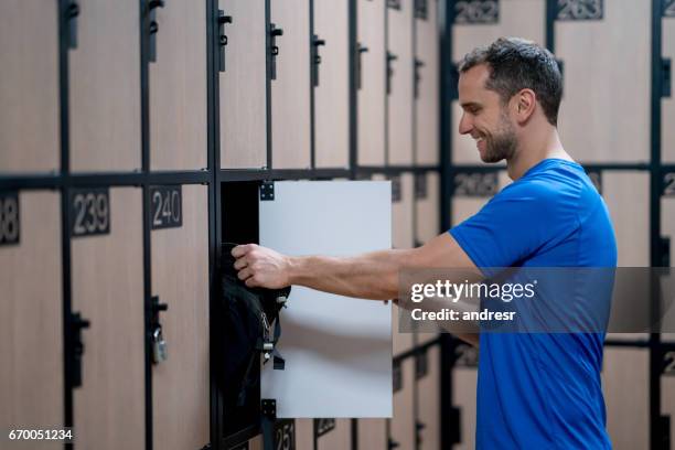 man in the dressing room at the gym - locker stock pictures, royalty-free photos & images