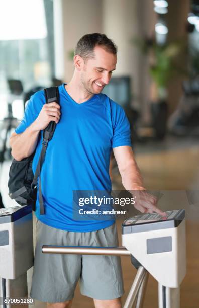 man entering the gym with a fingerprint scan - entering gym stock pictures, royalty-free photos & images