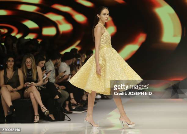 Model displays a creation by Lebanese fashion designer Abed Mahfouz during Beirut Fashion Week on April 18, 2017.
