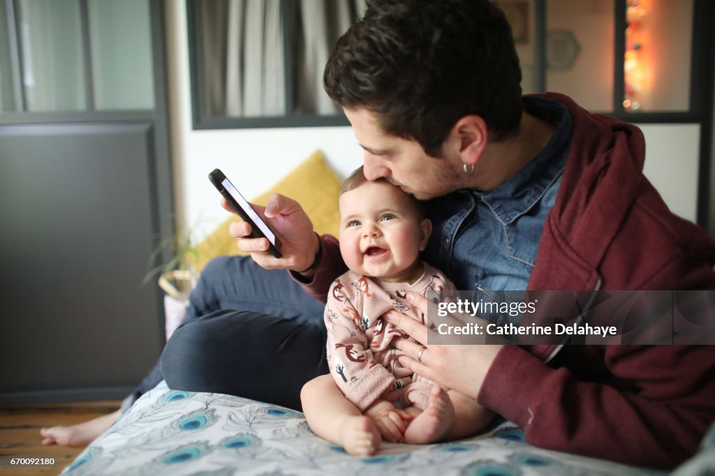 A 6 months old baby girl and her dad