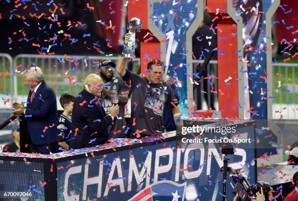 Tom Brady of the New England Patriots raises the Vince Lombardi trophy after the Patriots defeat the Atlanta Falcons 34-28 in overtime of Super Bowl...