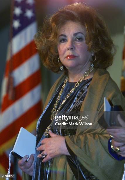 Eliabeth Taylor listens to speakers after recieving the Presidential Citizens Medal award from President Bill Clinton in Washiongton, DC. The...