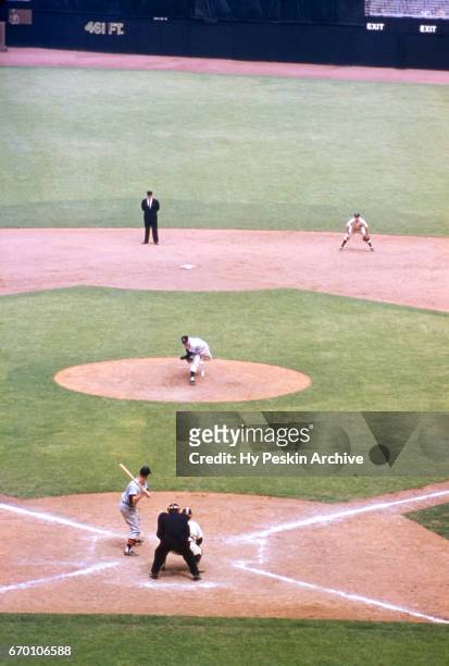 Pitcher Whitey Ford of the New York Yankees throws the pitch to Harvey Kuenn of the Detroit Tigers during an MLB game on May 13, 1955 at Yankee...