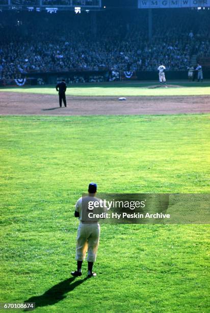 Duke Snider of the Brooklyn Dodgers looks in from centerfield as pitcher Russ Meyer of the Dodgers looks in to get the sign during Game 5 of the 1953...