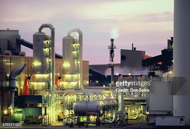 coal gassification plant lit up at dusk - spirou stock pictures, royalty-free photos & images