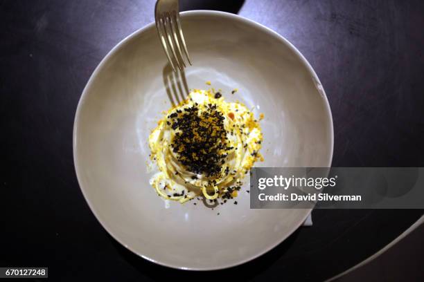 First course of "Chitarra spaghetti cooked in buffalo milk with anchovies, bottarga breadcrumbs and lemon Amatriciana in Modena" on the menu for 12...