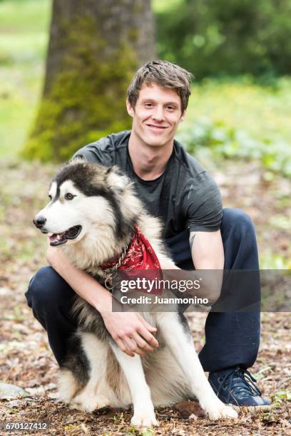 young man posing with his dog - anchorage alaska stock pictures, royalty-free photos & images