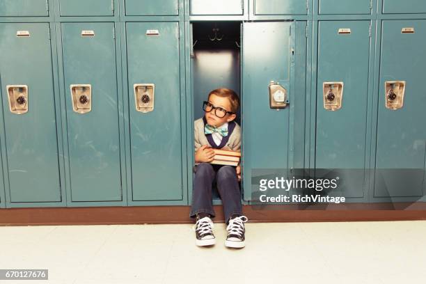 young boy nerd is happy at his locker - kids invasion stock pictures, royalty-free photos & images