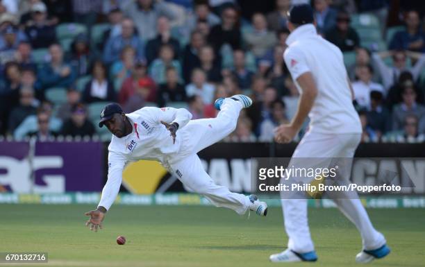 England's Michael Carberry drops an easy chance from the bat of Australia's Brad Haddin as James Anderson watches during the 2nd Ashes cricket Test...