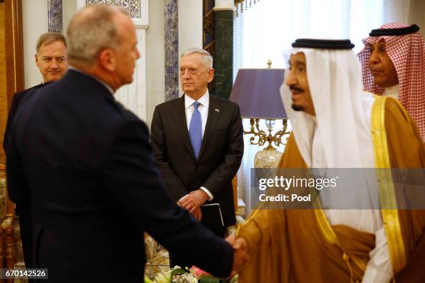 Defense Secretary James Mattis looks on as Saudi Arabia's King Salman bin Abdulaziz Al-Saud welcomes the U.S. Delegation on April 19, 2017 in Riyadh,...