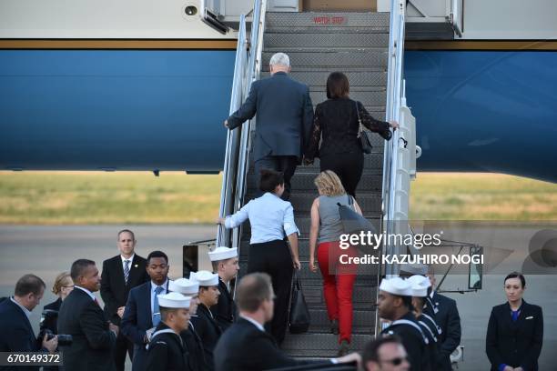 Vice President Mike Pence , his wife Karen , and their two daughters Audrey and Charlotte walk up to their aircraft as they depart Japan from the US...