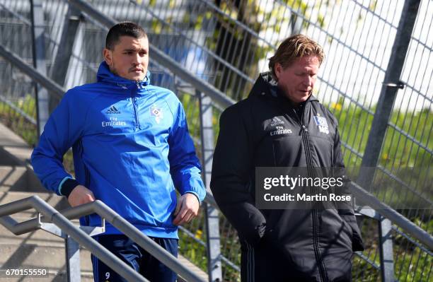 Kyriakos Papadopoulos of Hamburg talks to head coach Markus Gisdol during a training session of Hamburger SV at Volksparkstadio on April 19, 2017 in...